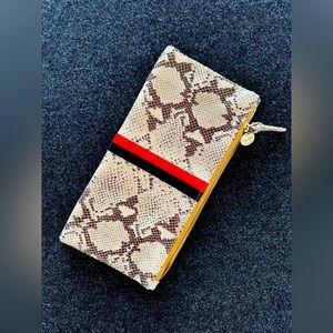 Like new, CLARE V. fold over leather clutch.